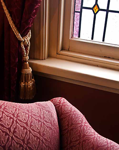 chair and velvet drape